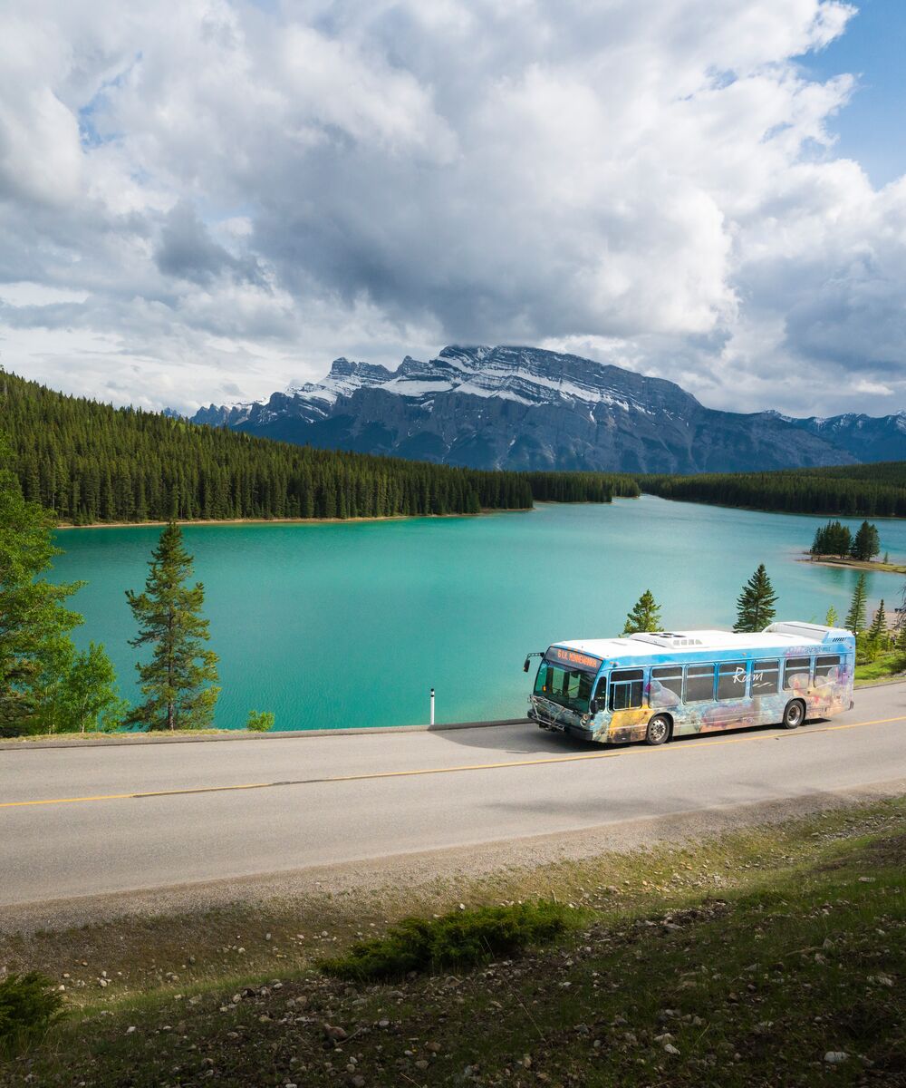 The perfect captured of a Roam Transit shuttle passing the Two Jack Lake.